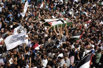 Palestinians carry the body of Mohammed Abu Khudair during his funeral in Shuafat