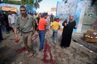 Blood on the ground at a United Nations run school after Israeli air strikes in Rafah in the southern Gaza Strip
