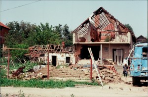 Damaged home adjacent to destroyed neighborhood on Vuk Karadzhich Street. Yugoslavia Photo: Gregory Elich