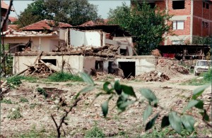 Caption: Damaged home near bombed neighborhood of Nishka and Uzhichka Streets. Photo: Gregory Elich