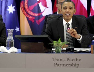 Obama speaks as Hassanal Bolkiah listens during the Trans-Pacific Partnership Leaders meeting at the Hale Koa Hotel during the APEC Summit in Honolulu