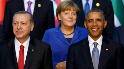 (From L) Turkish President Recep Tayyip Erdogan, German Chancellor Angela Merkel and US President Barack Obama stand for a family photo during the G20 Leaders Summit in Antalya, Turkey, November 15, 2015. ©AFP