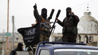 Members of al Qaeda's Nusra Front gesture as they drive in a convoy touring villages in the southern countryside of Idlib
