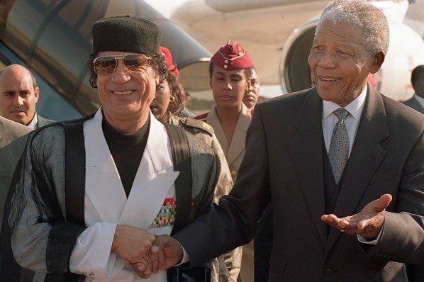 Libya leader Col. Muammar Gaddafi and South African counterpart Nelson Mandela during the early 1990s.